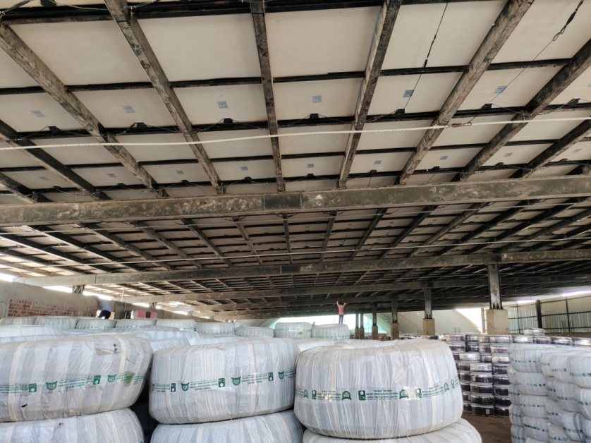 Solar panels installed across an industrial roof